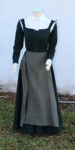 Spiral laced green wool kirtle with linen apron