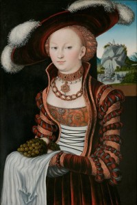 Cranach the Elder 1528, portrait of a young woman holding grapes and apples.