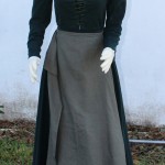 Spiral laced green wool kirtle with linen apron