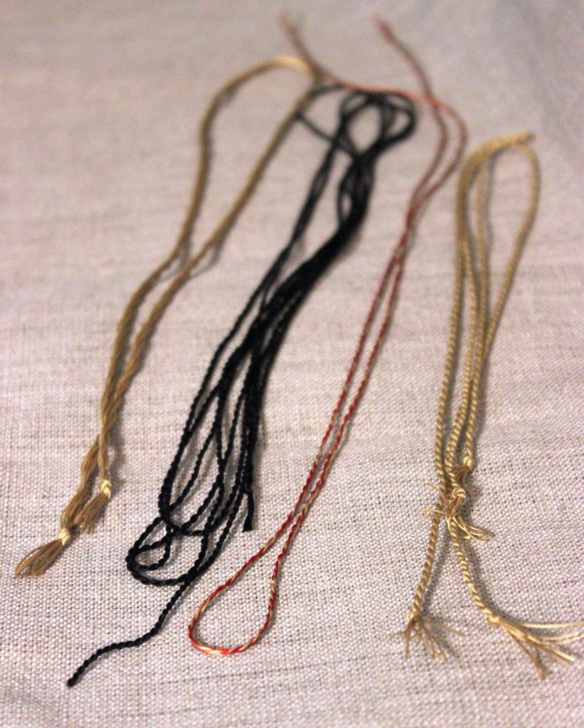 Gold black and red silk cords