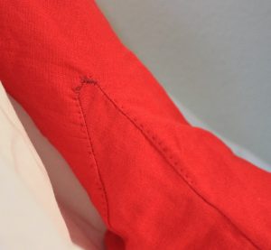 Bright Red Hand Sewn 16th Century Linen Stocking Close up of Gusset