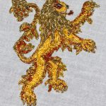 Lannister Embroidery a gold lion worked in yellow thread with gold bullion mane and tail