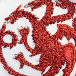 Targaryen Embroidery a red three headed dragon on a white cotton background
