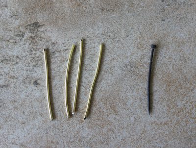 Brass wire next to original pin